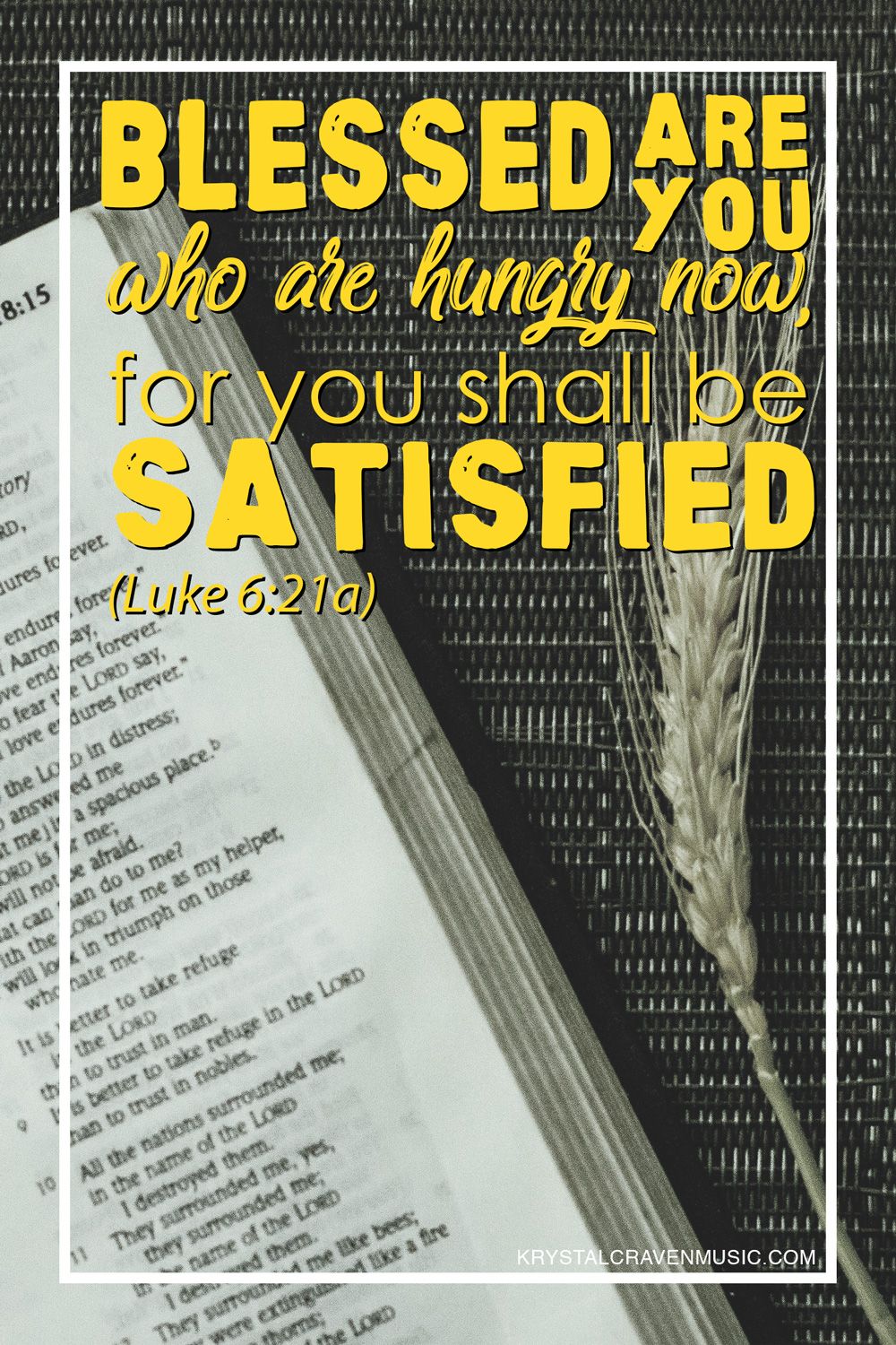 The devotional title text "Blessed are the Hungry" overlaying a top down image of an open Bible on a placemat with a couple strands of wheat laying next to it.