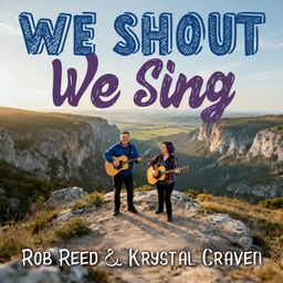 A man and a woman stand on a mountain taken from an aerial shot holding guitars "We Shout We Sing".