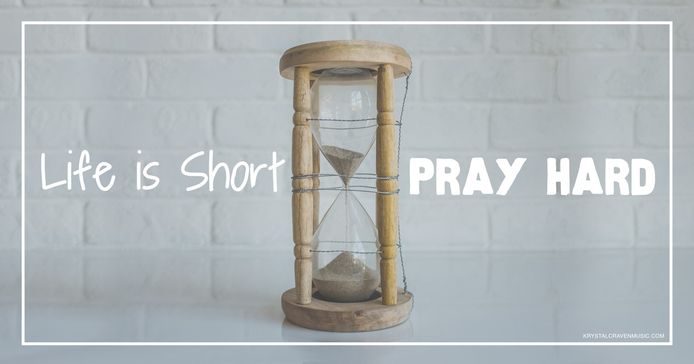 Devotional title text overlaying an hourglass with a wooden frame on a white counter with a white brick backsplash.