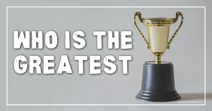 The title text "Who Is The Greatest" in a bold white font on a gray background to the left of a trophy.