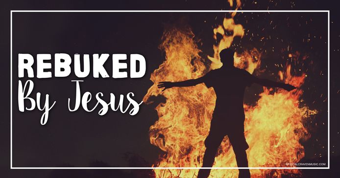 The title text "Rebuked By Jesus" in a large white font to the left of the silhouette of a man with his arms reaching out to his sides and standing in front of a very large fire.