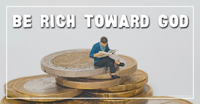 The title text "Be Rich Toward God" over a picture of a figurine reading a magazine newspaper sitting on a stack of coins.