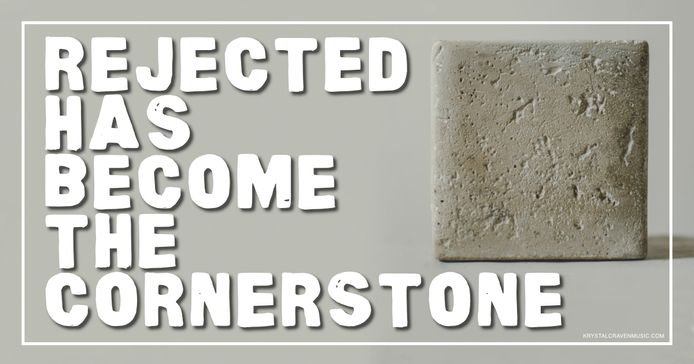 A stone block with the text wrapping around it: "Rejected Has Become the Cornerstone"