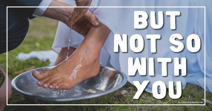 A woman's foot being washed over a bowl of water with the words "But Not So With You" overlaying the image.