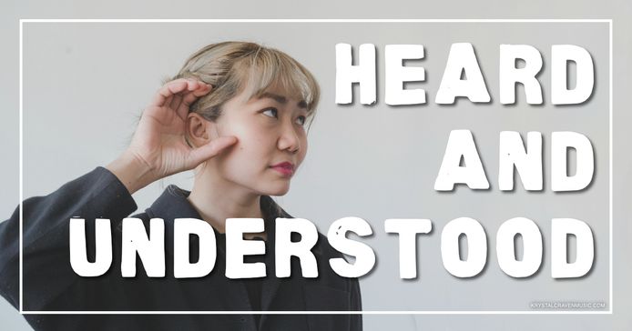 An image of woman cupping her ear to attempt to hear better. Overlaying the image are the words "Heard and Understood".