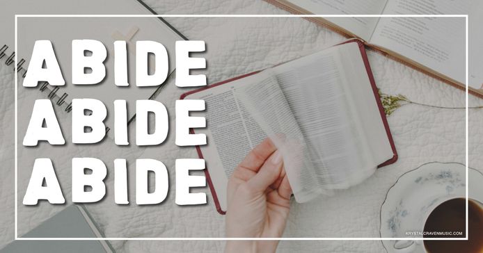 A bible on a table being opened by a hand. Overlaying the image are the words "Abide, Abide, Abide".