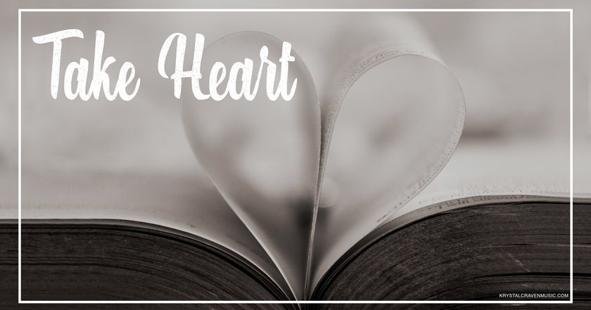 Devotional title text overlaying an open book with pages folded in towards the center to make the shape of a heart with the pages.
