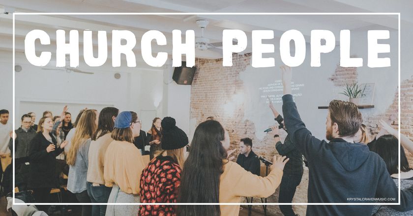 Devotional title text overlaying a small church congregation during worship with hands raised in worship. The image is taken from behind the congregation and the back wall behind the worship team is a brick wall.