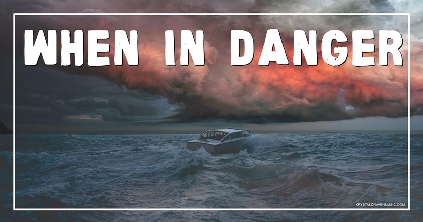 The devotional title text of "When in Danger" overlaying a stormy ocean horizon with a boat in the midst of waves and a red, cloudy sky.