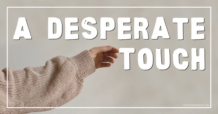 The devotional title text of "A Desperate Touch" overlaying a woman's arm with a beige sweater reaching her hand out as if to touch something. Her index finger touches the word "Touch".