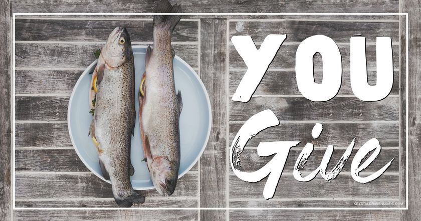 The devotional title text of "You Give" overlaying a wooden pallet with a plate on top that has two fish on it.