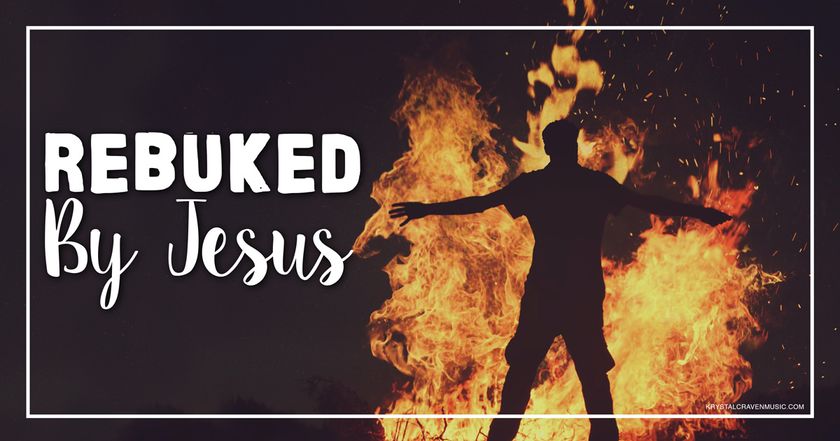 The title text "Rebuked By Jesus" in a large white font to the left of the silhouette of a man with his arms reaching out to his sides and standing in front of a very large fire.