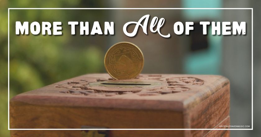 A coin standing on edge on top of a wooden box with the words "More Than All of Them" appearing above it.