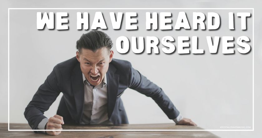A man in a suit aggressively bending over a table with a clenched fist on the table and his face contorted in rage with the words "We Have Heard It Ourselves" overlaying the image.